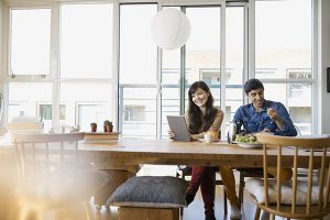 Couple eating at table